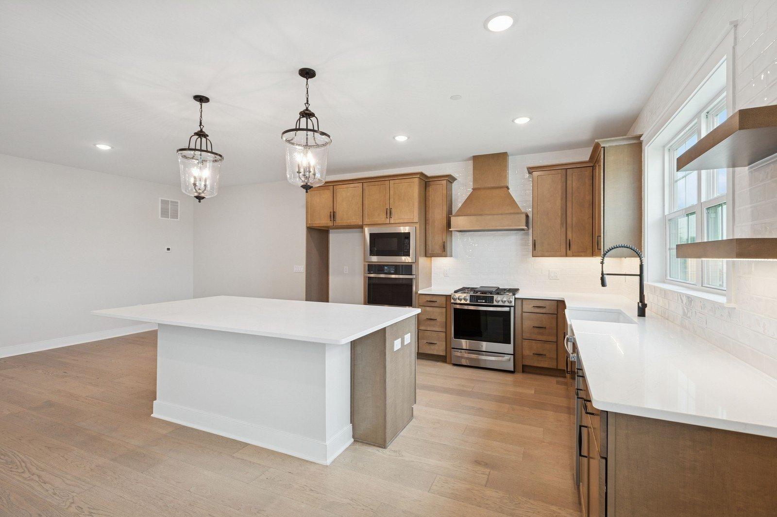 Kitchen with warm-toned cabinetry