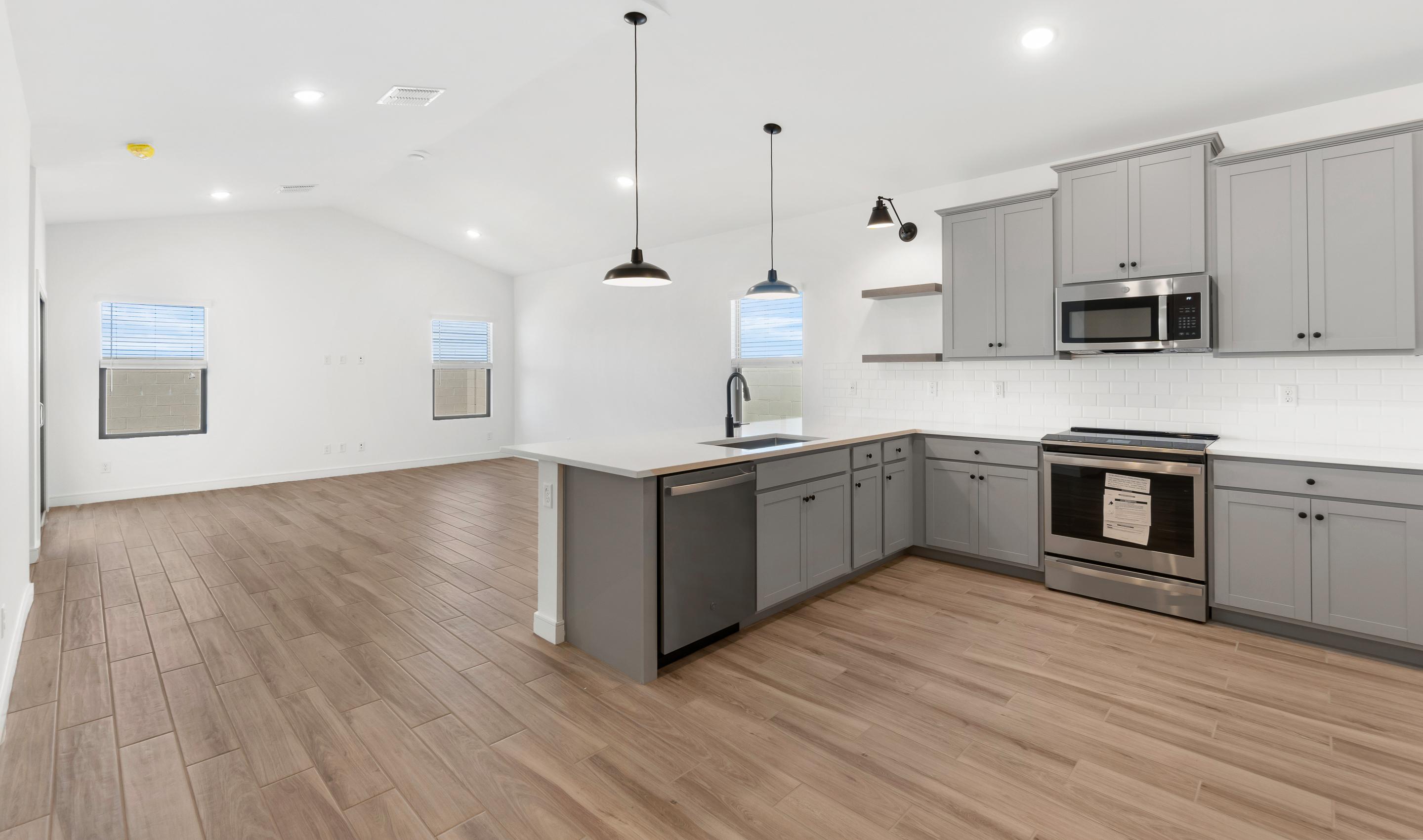 Kitchen with grey cabinets