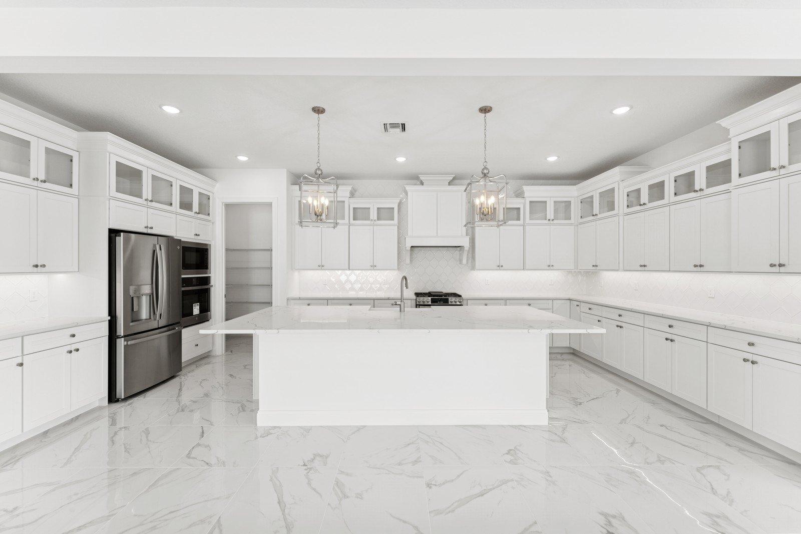 Kitchen with Brellin White cabinetry & upper glass cabients