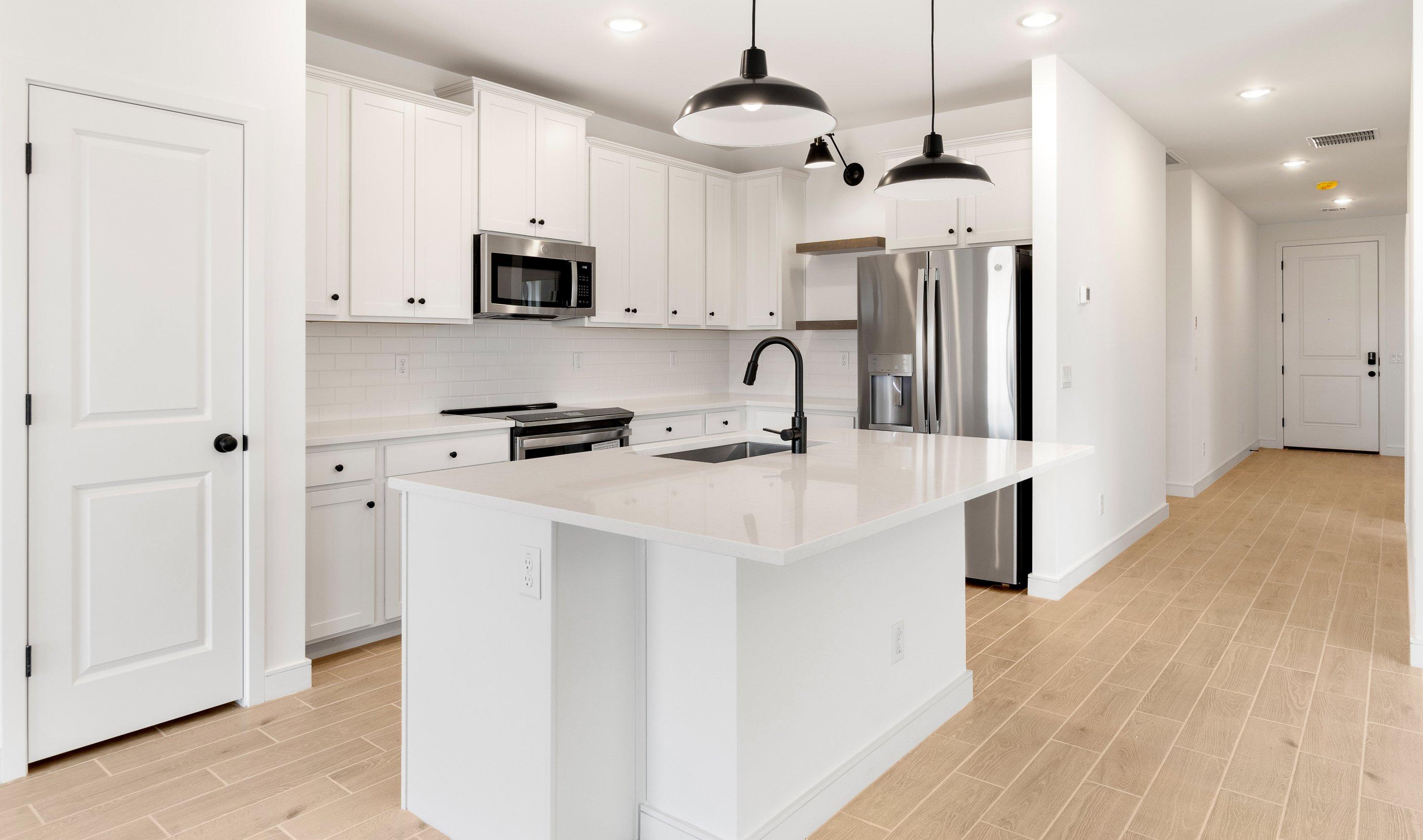 Kitchen with pendant lighting & floating shelves