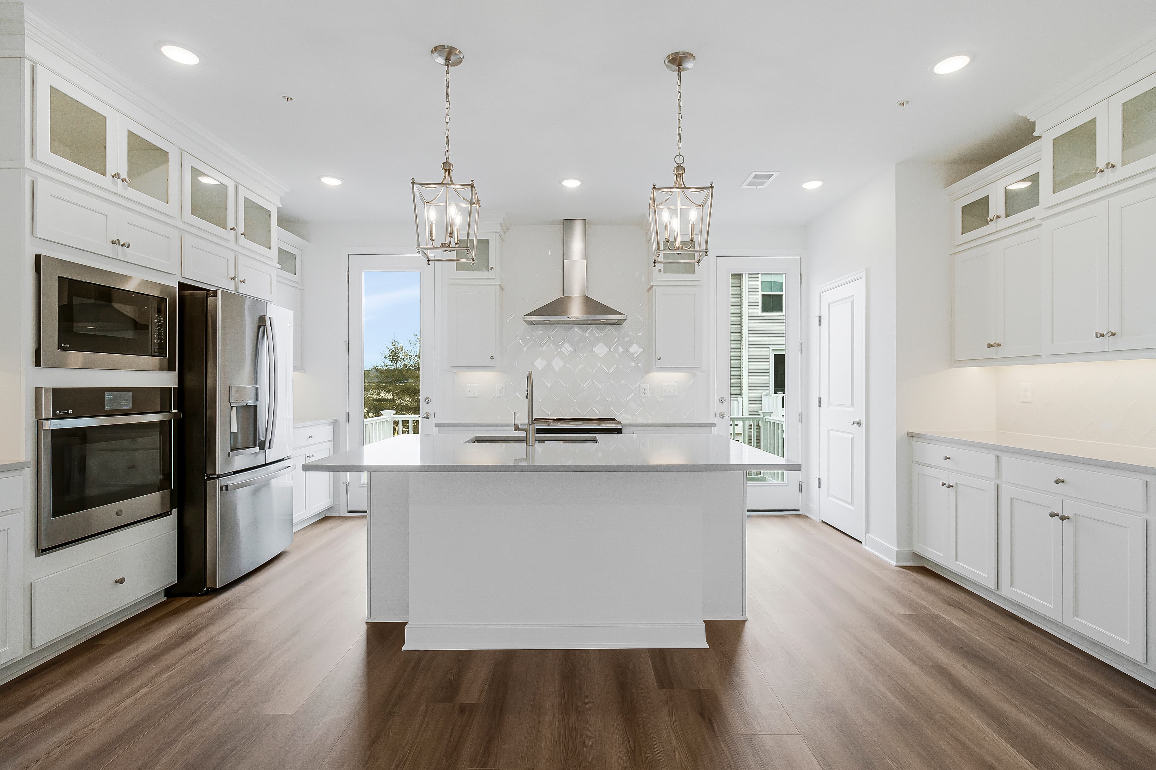 Kitchen with vast island & pendant lights