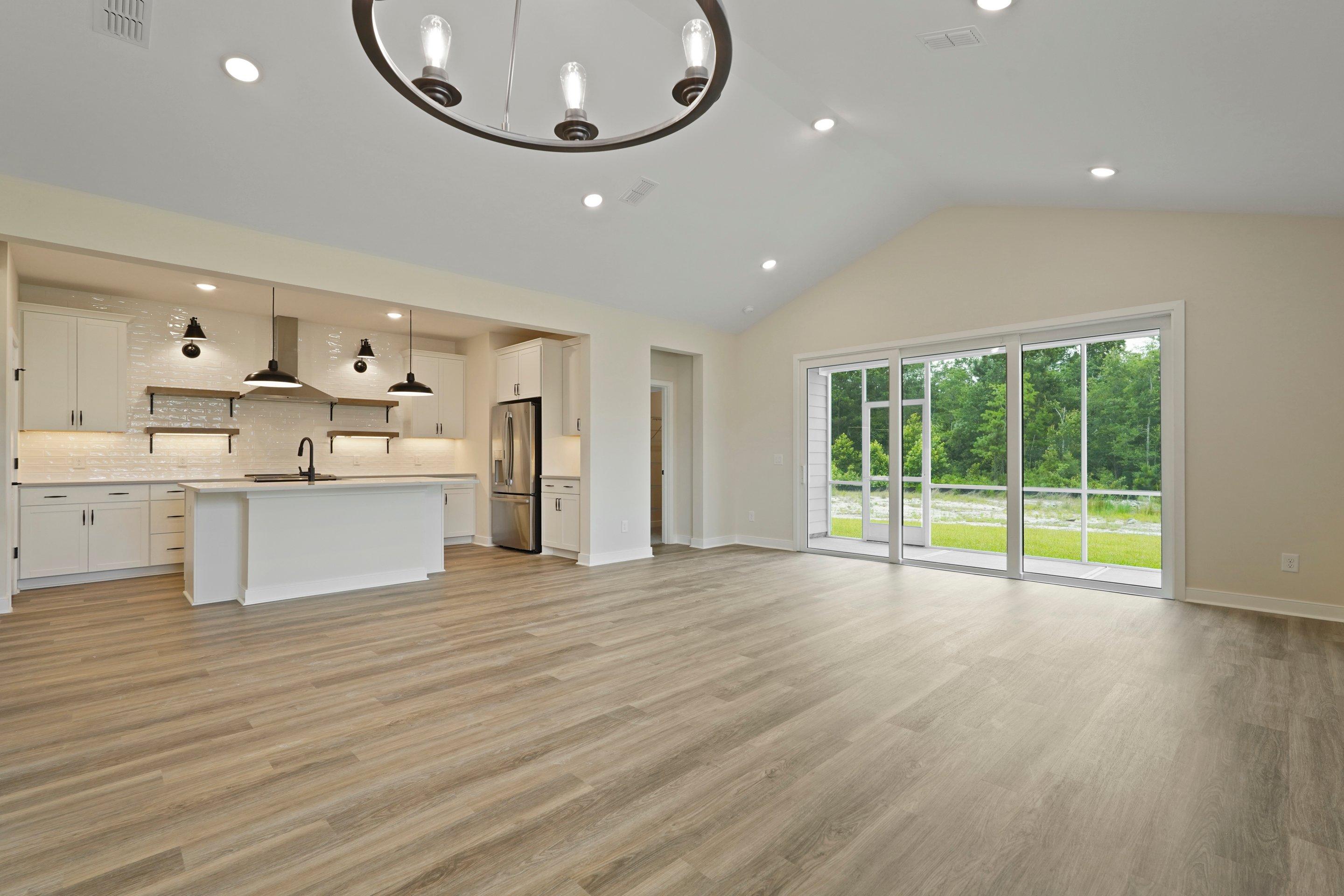 Soaring vaulted ceiling unites great room & dining area