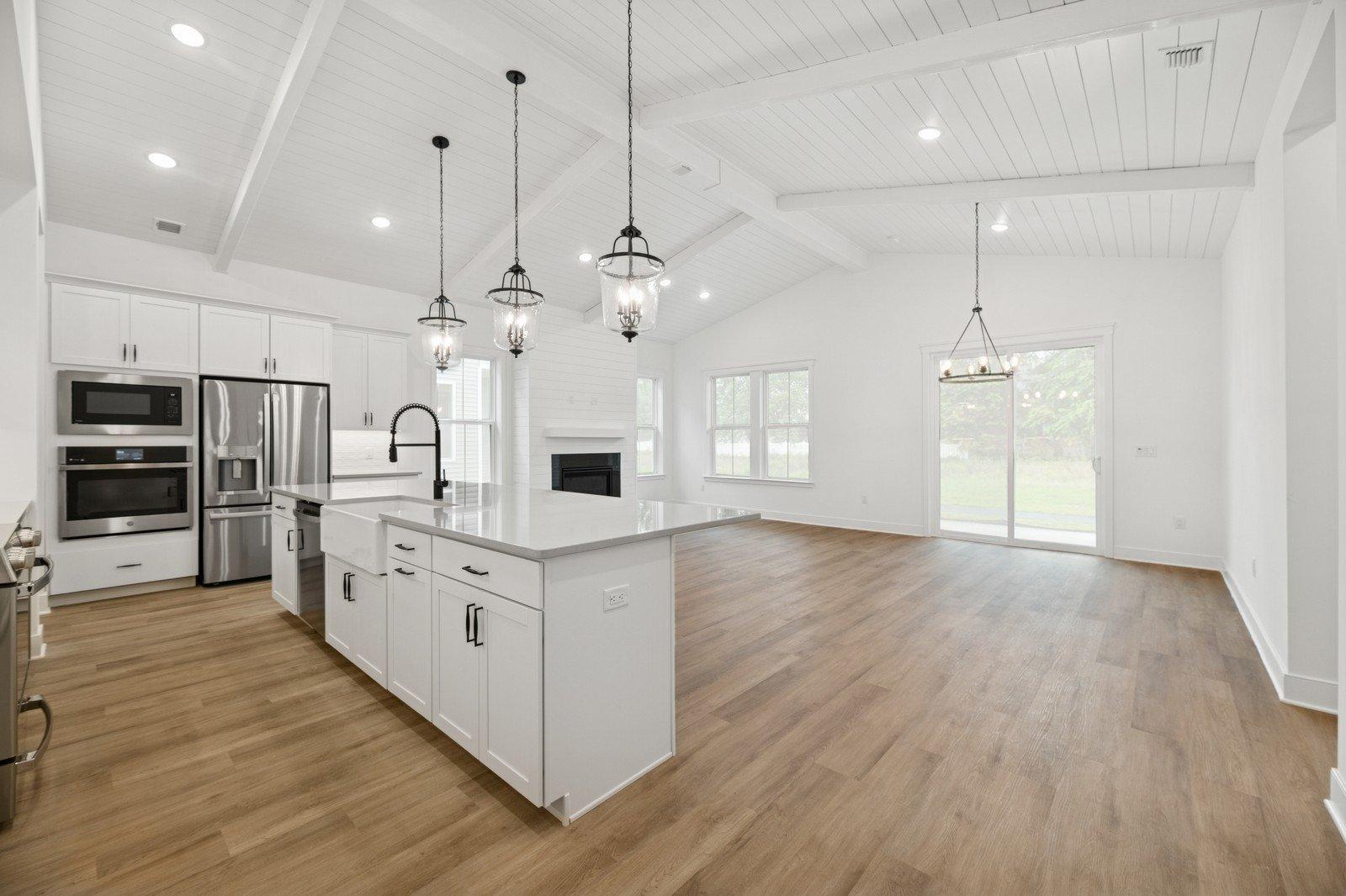 Soaring vaulted ceiling unites main living spaces