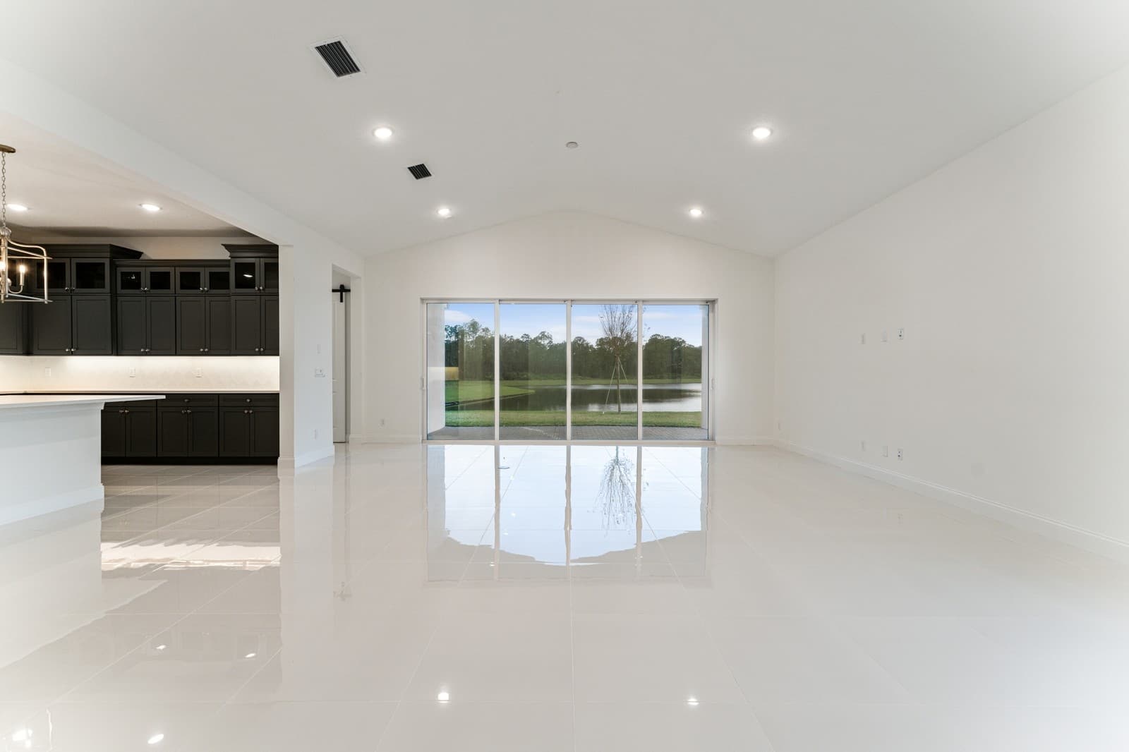 Open concept living spaces with vaulted ceiling