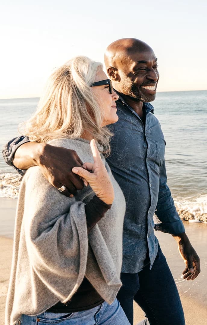 127795 Older Couple Walking on Beach USP Crop