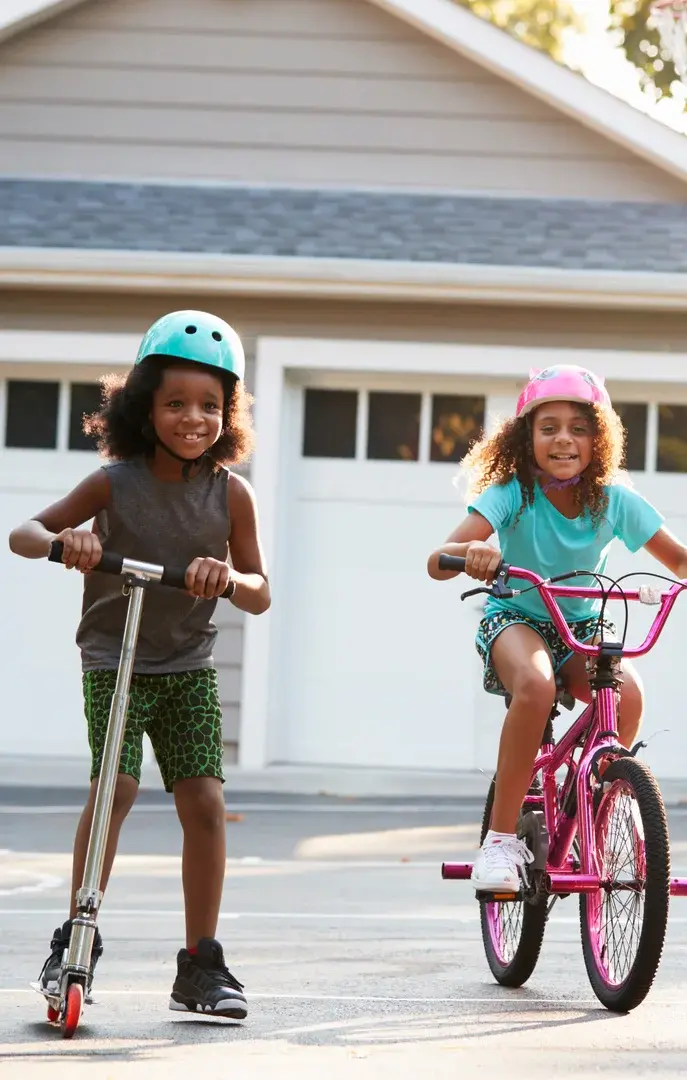 Kids on Bikes in Driveway USP Crop