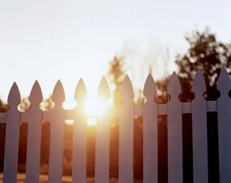 Picket Fence with Sun Setting