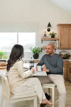 Elevon Frankfurt Couple Having Coffee in Kitchen Farmhouse Palette 6 Level