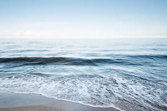 Banner Tide Rolling in on Shore with Horizon