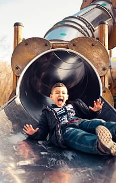 60384 Kid Sliding down a Slide USP Crop
