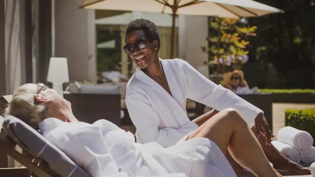 143183_Women Relaxing Poolside_Website Crop