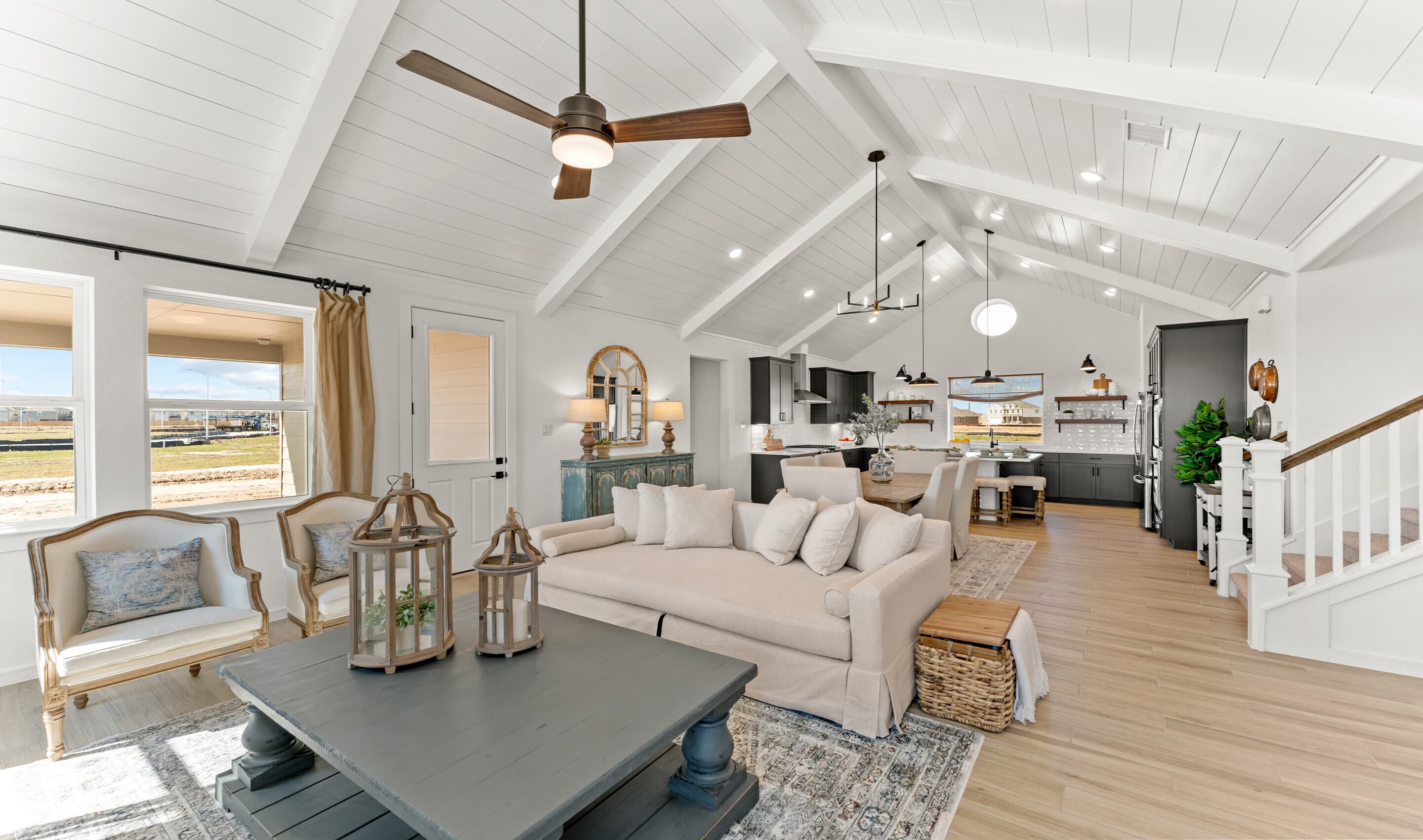 Vaulted ceiling with white painted ceiling beams and shiplap