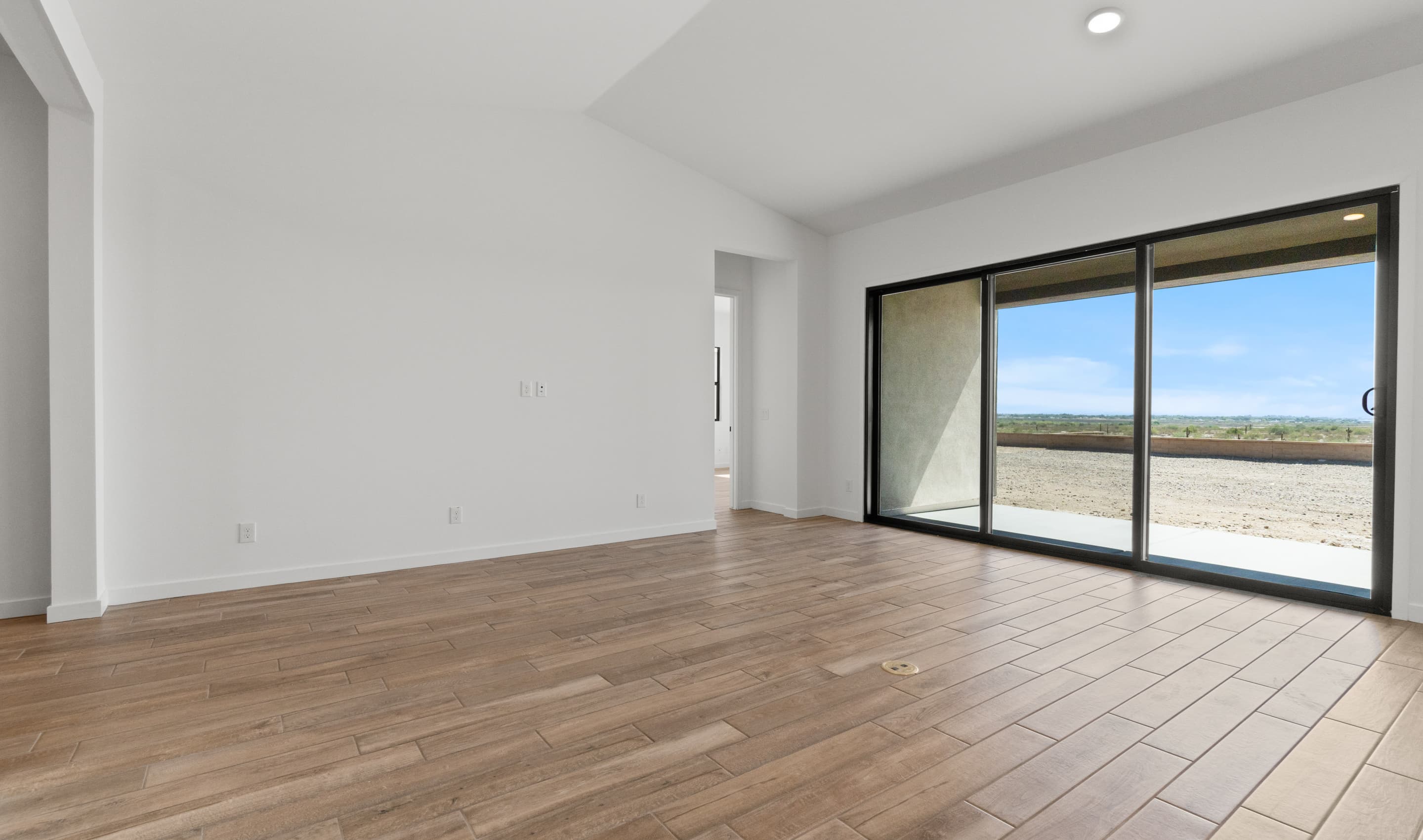 Great room with multi-slide glass doors to covered patio