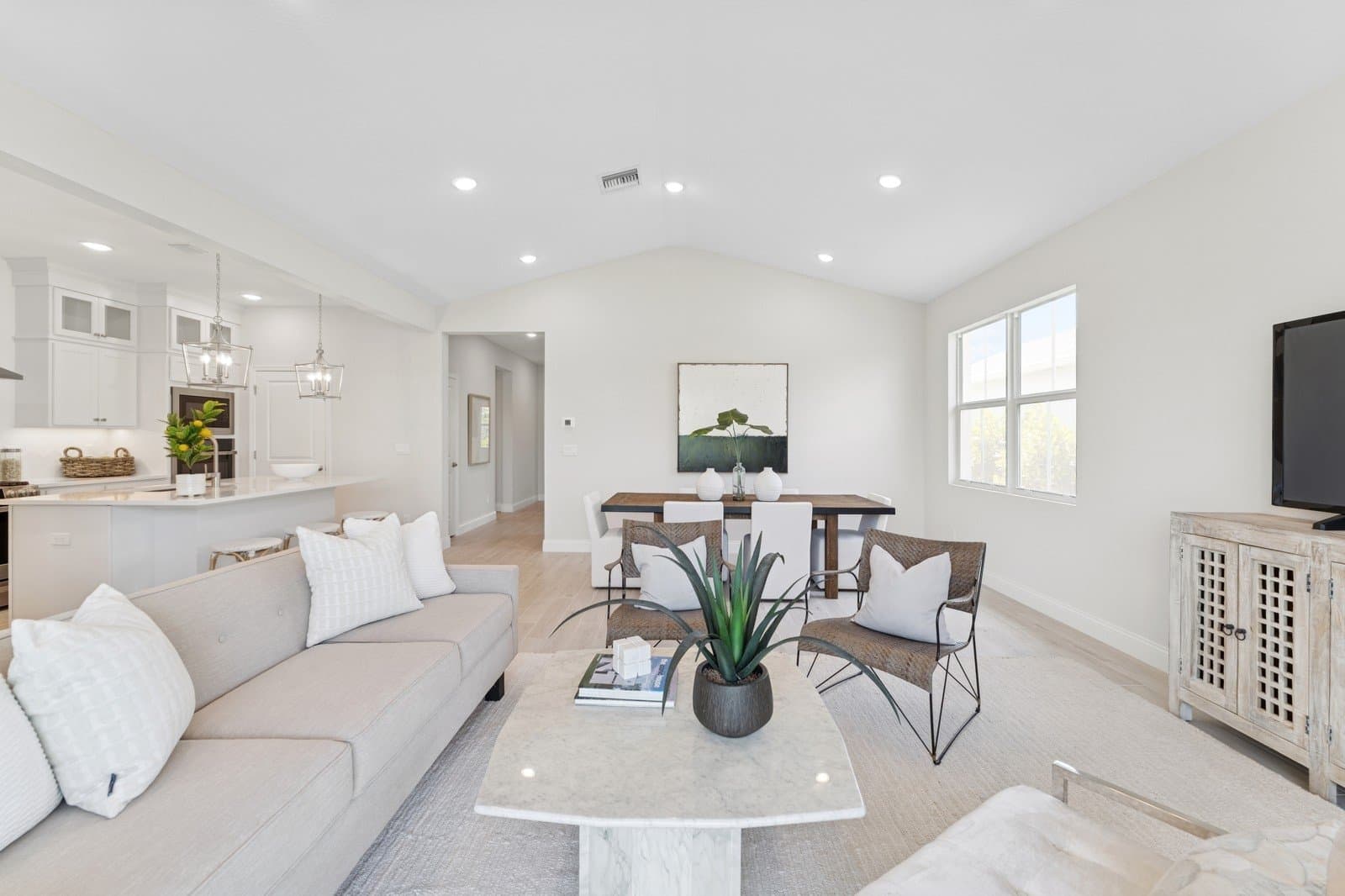 Open concept living spaces with vaulted ceiling