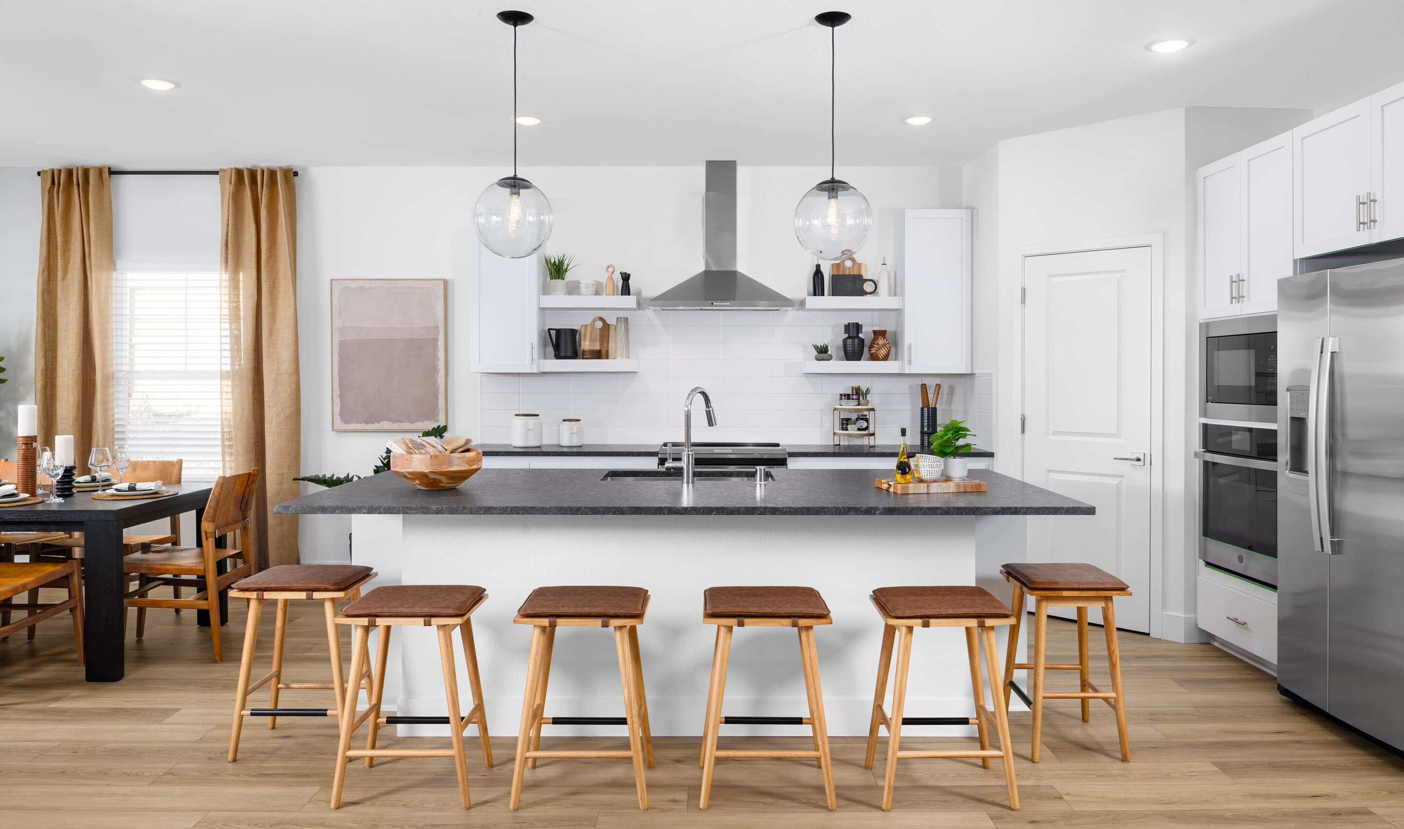 Kitchen with pendant lighting and white subway tile backsplash