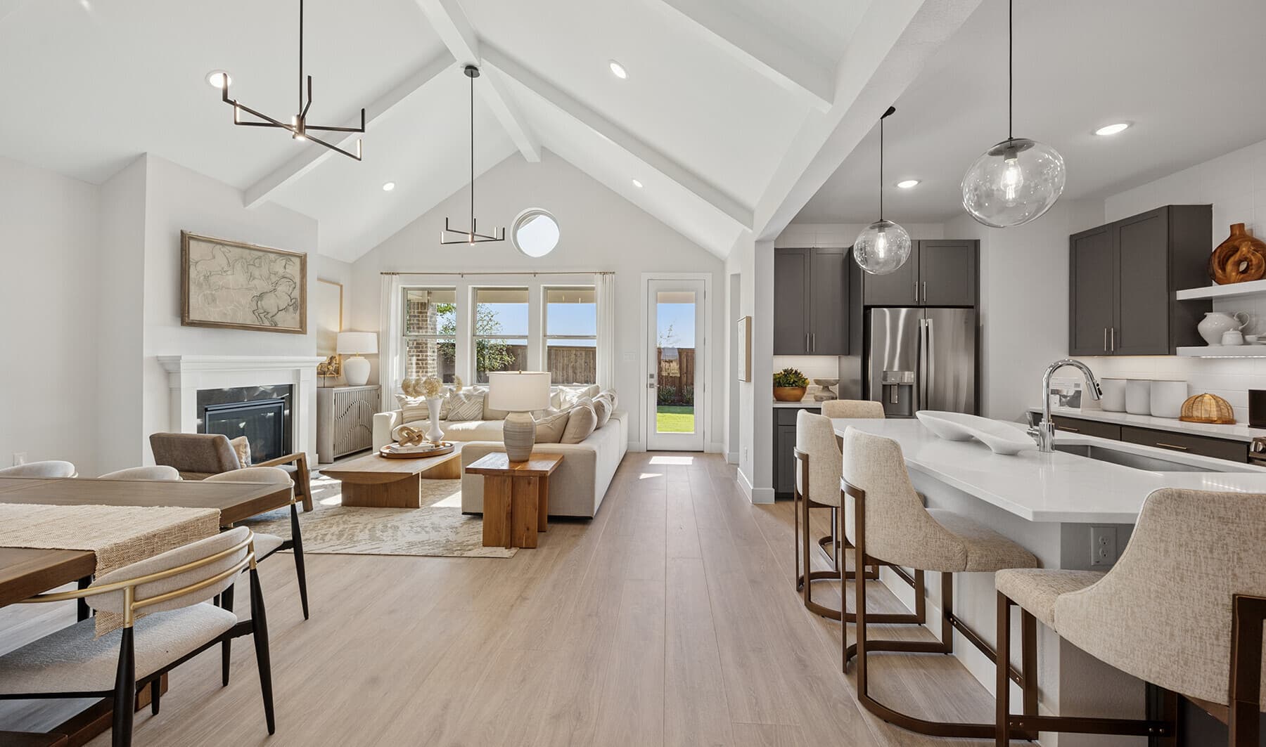 Great room with vaulted ceiling & white ceiling beams