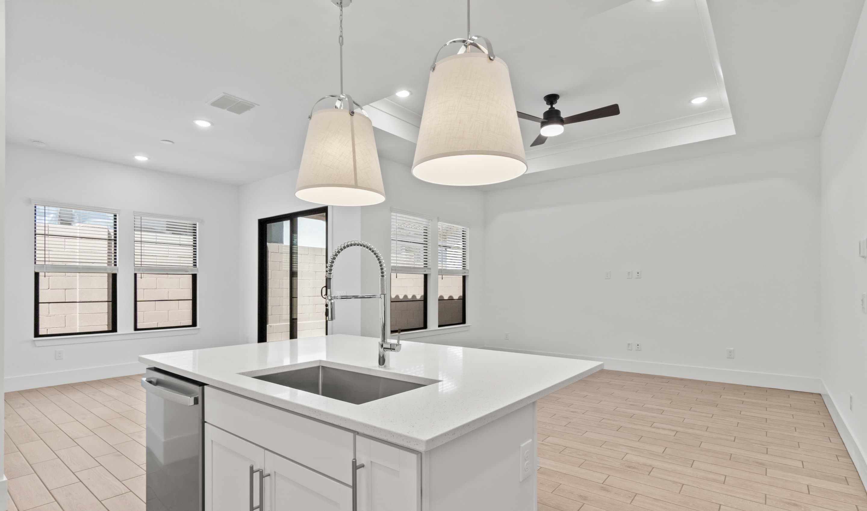 Kitchen with sleek pendant lighting