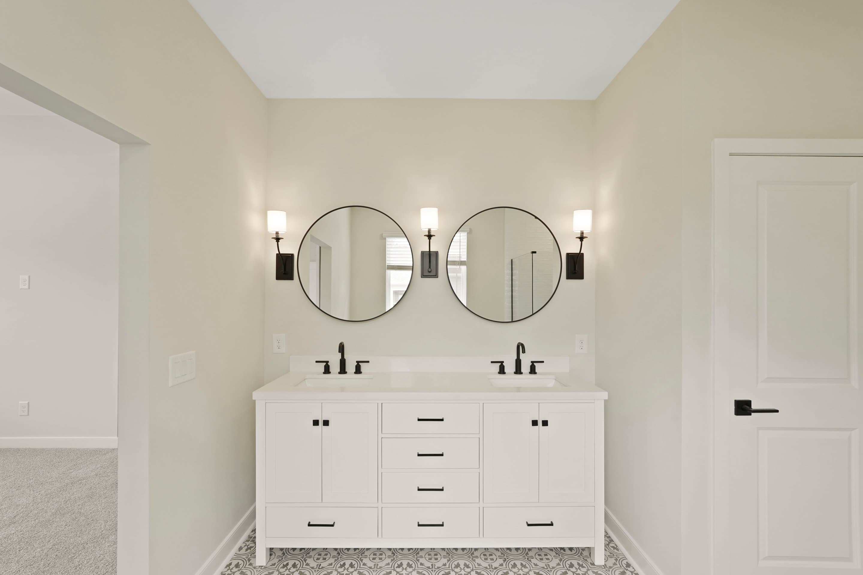 Primary bath featuring freestanding vanity with dual sinks