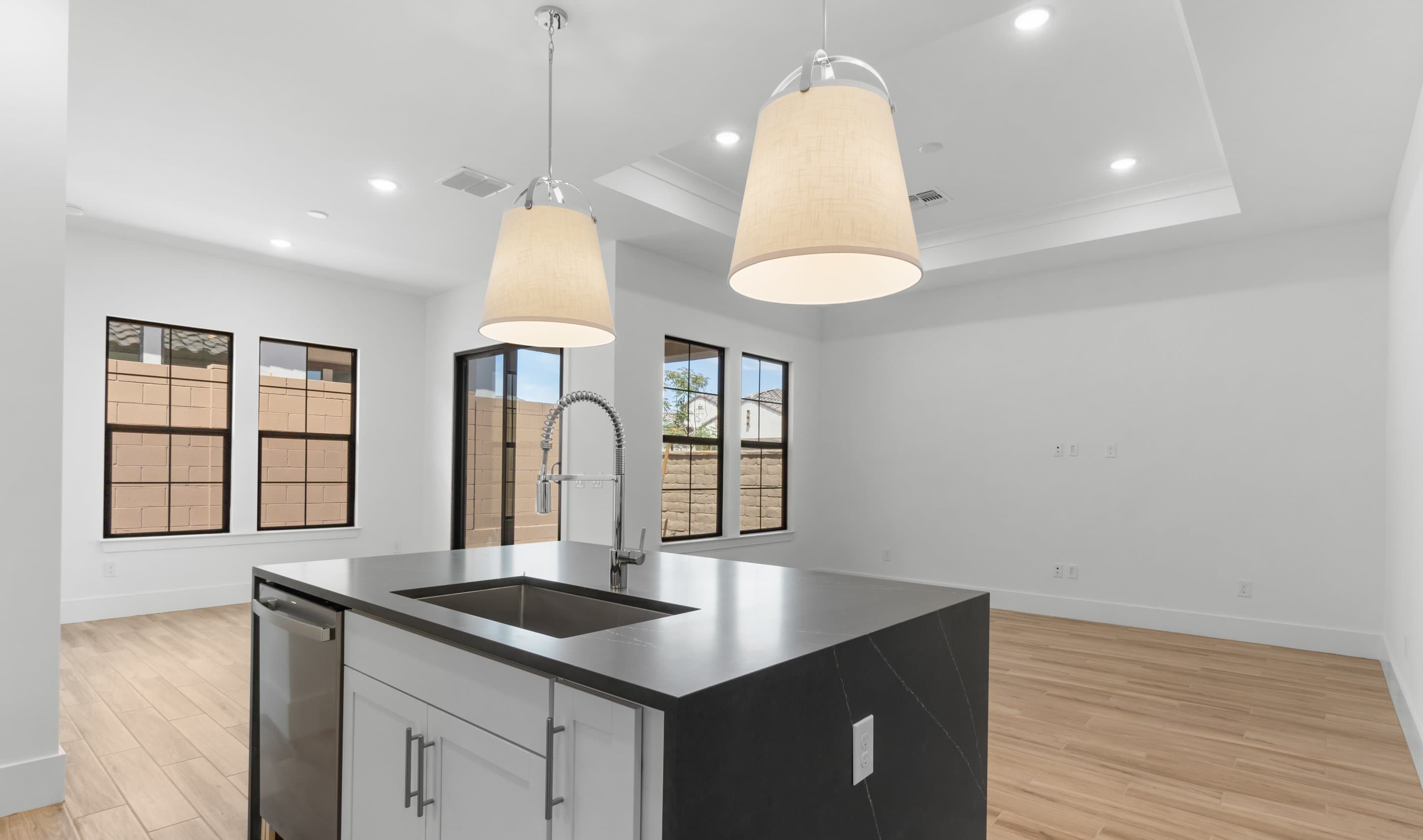 Kitchen with sleek pendant lighting