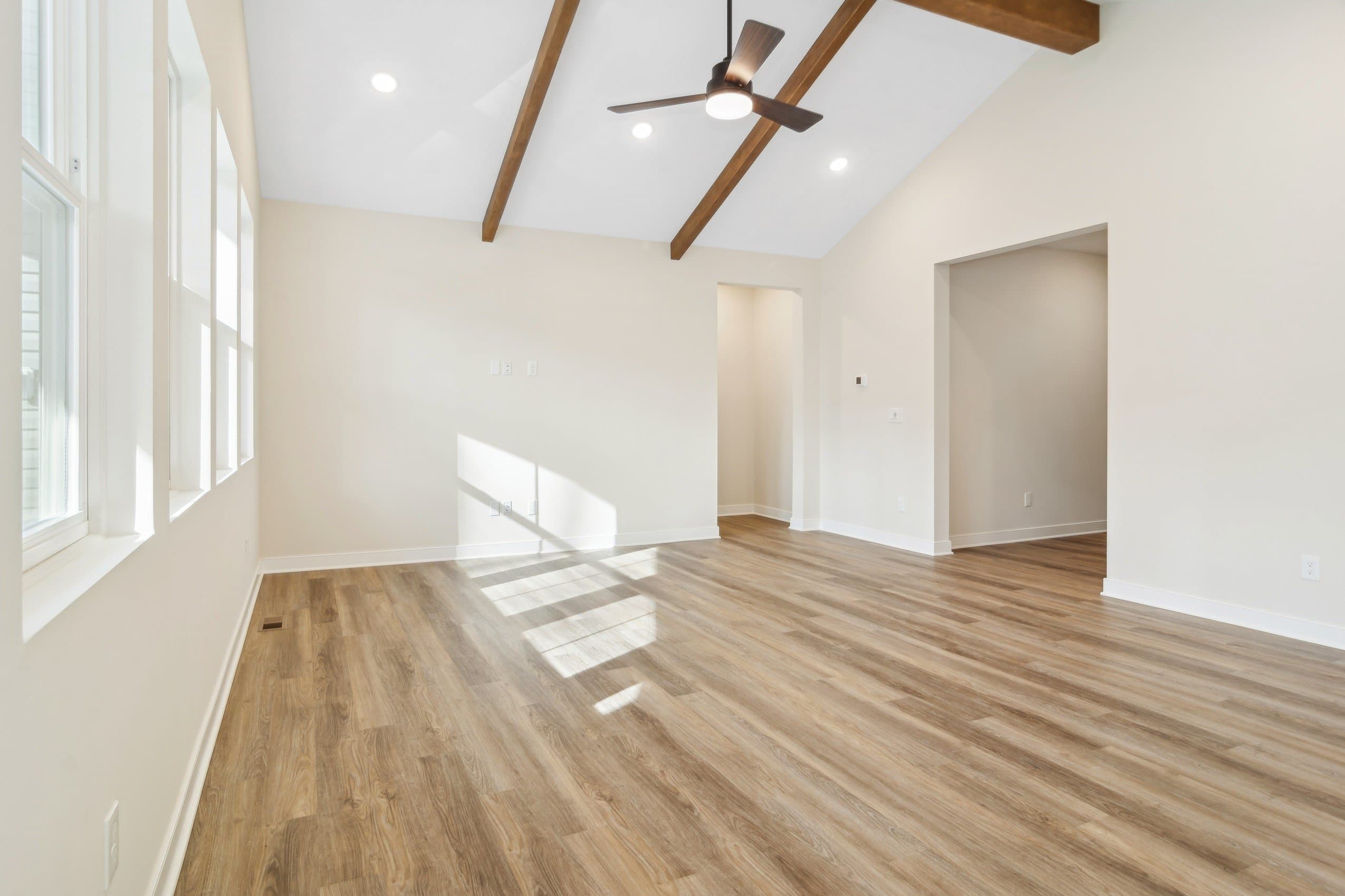 Great room with stained ceiling beams
