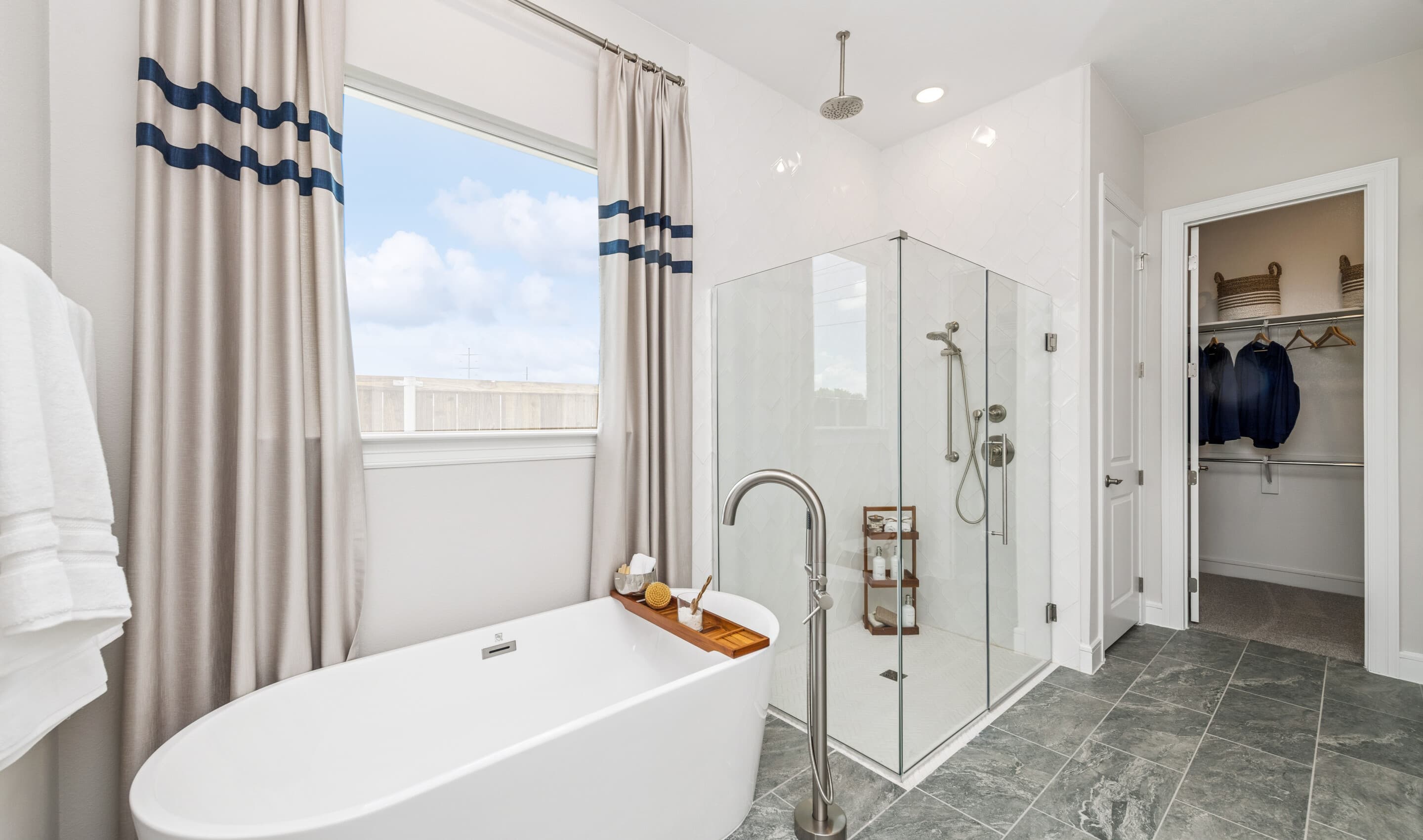 Primary bath with freestanding tub & glass shower enclosure