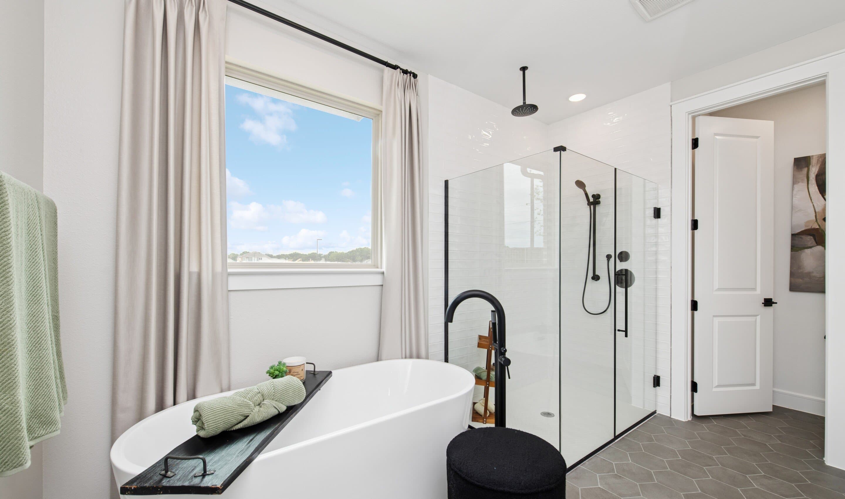 Primary bath freestanding tub and glass shower enclosure