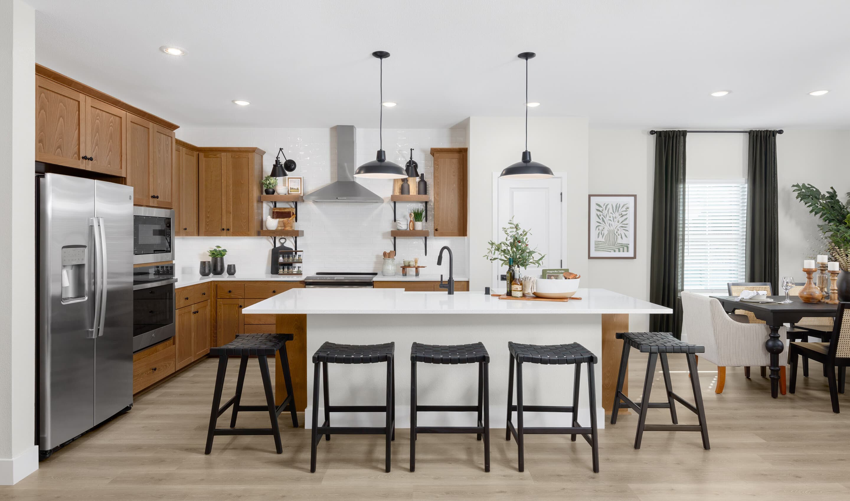 Kitchen with floating shelves and pendant lighting