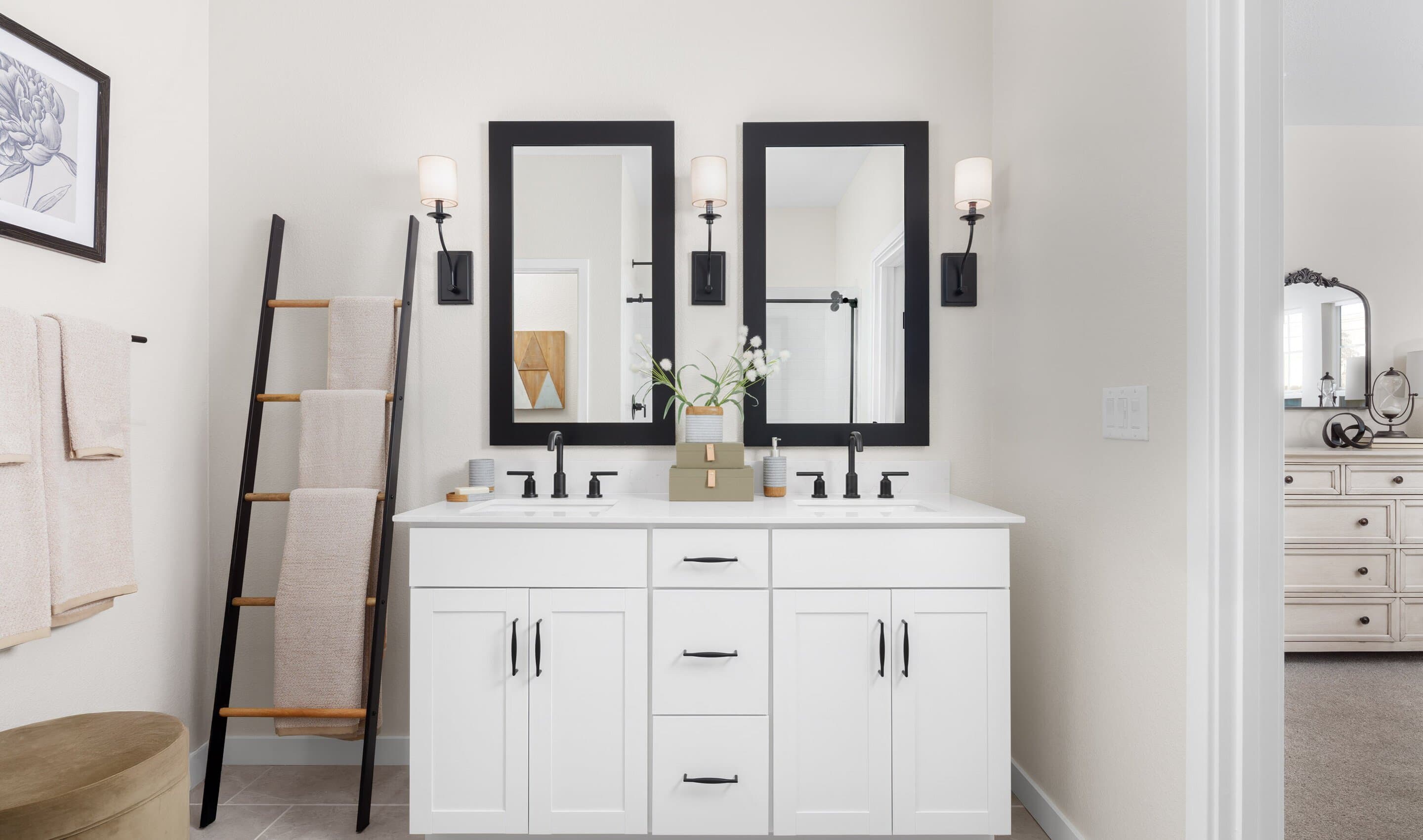 Primary bath features vanity with dual sinks