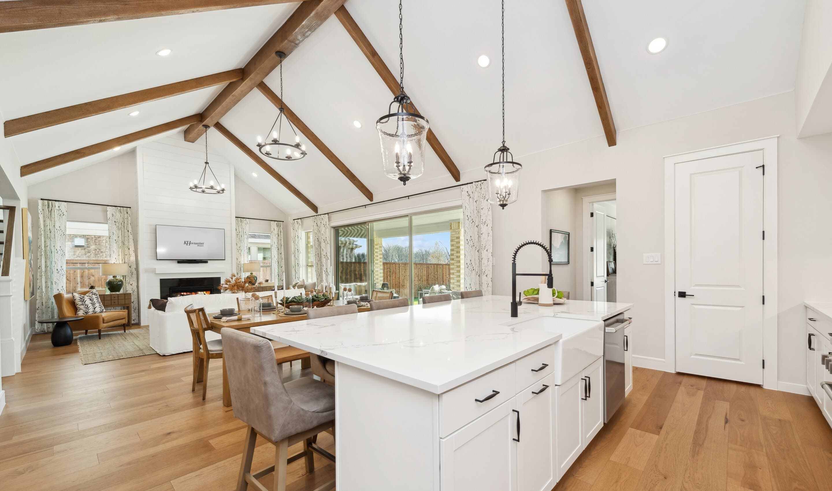 Kitchen with vaulted ceiling and stained ceiling beams