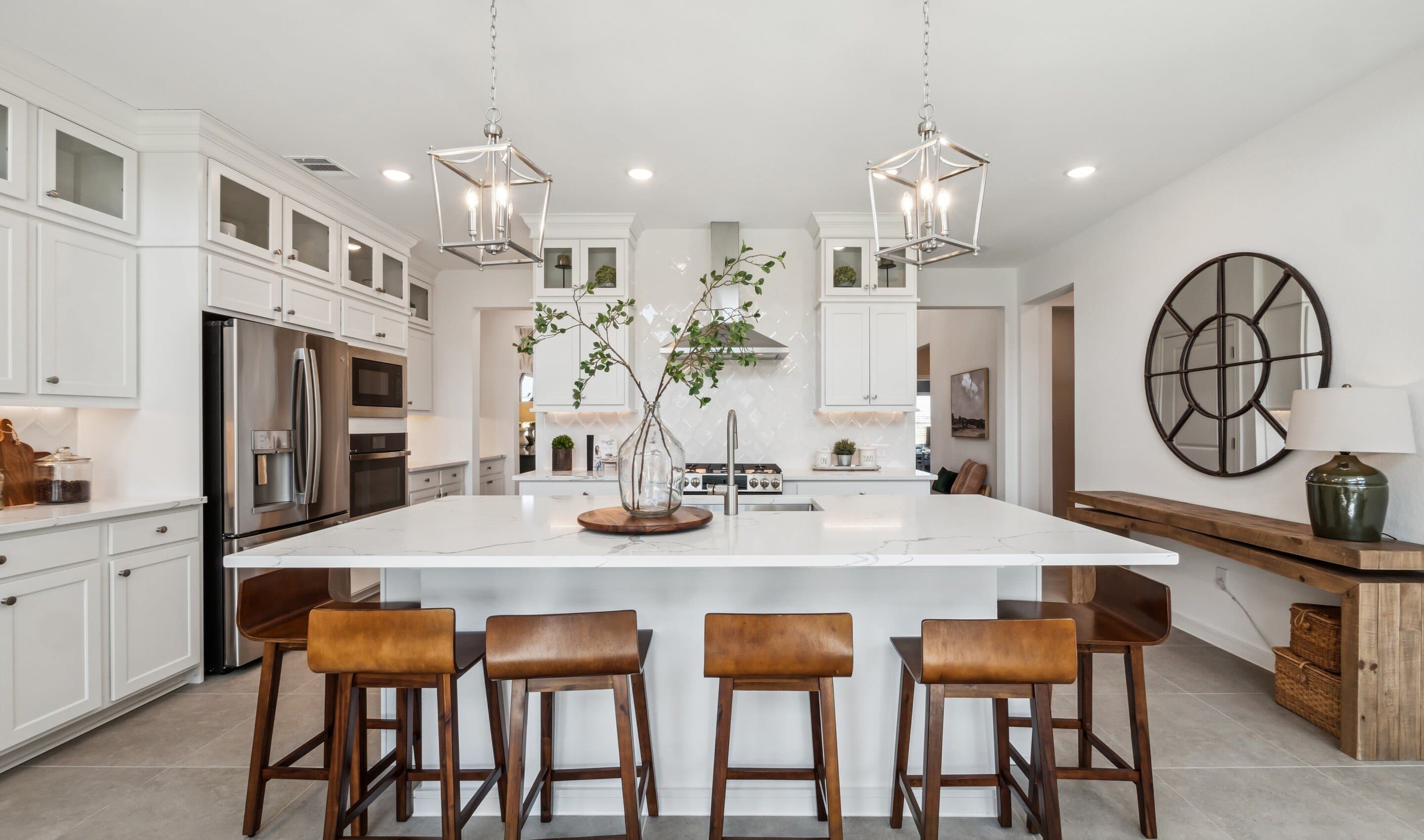 Kitchen with stacked glass-front upper cabinets over solid lowers