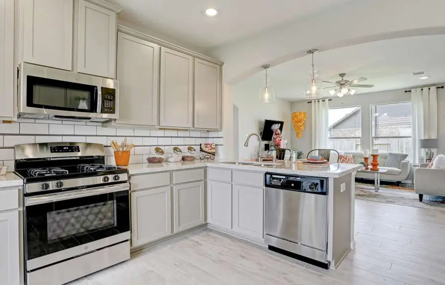 Kitchen peninsula with appliances