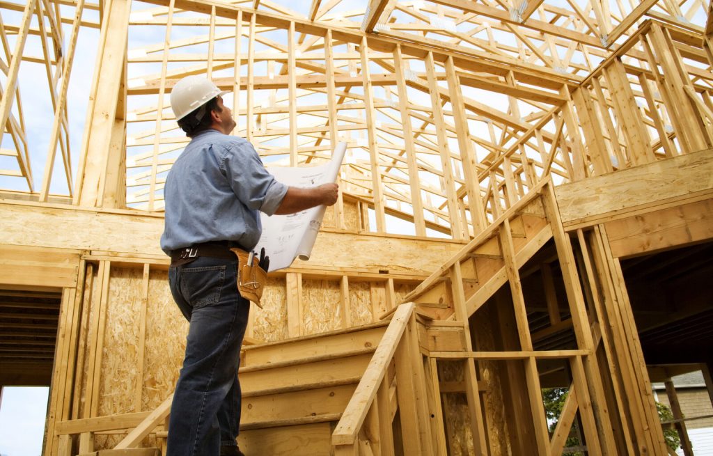 Home Building Foreman looking at plans for New Houston Homes